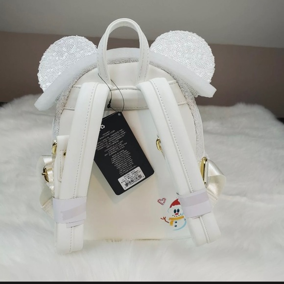 disney snowman minnie mouse sequin cosplay mini backpack Loungefly Platinum width is measured across the bottom of the bag.)n Lounge Fly Disney Snowman Minnie